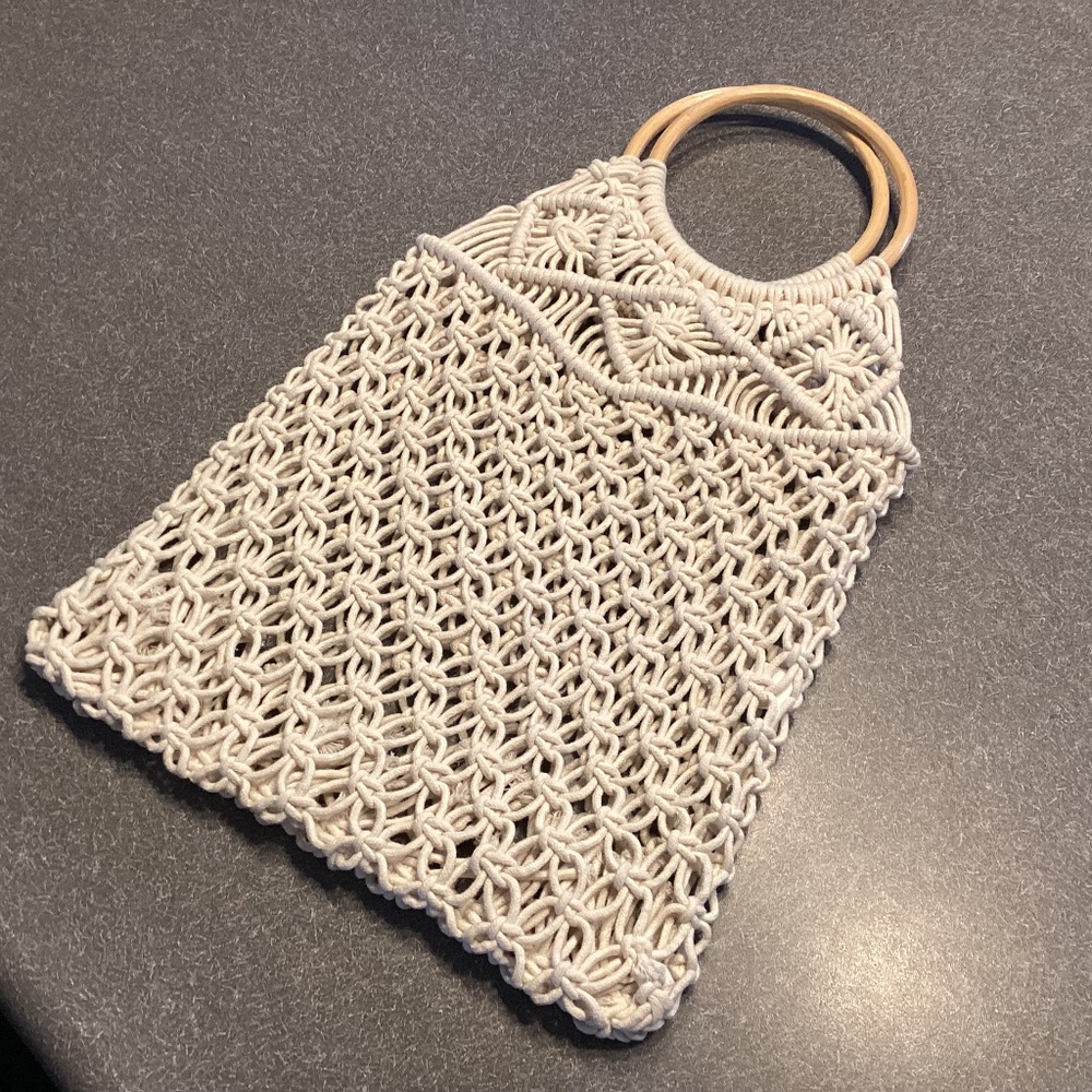 New, unique macrame purse or beach bag. Cream color with wooden handles.